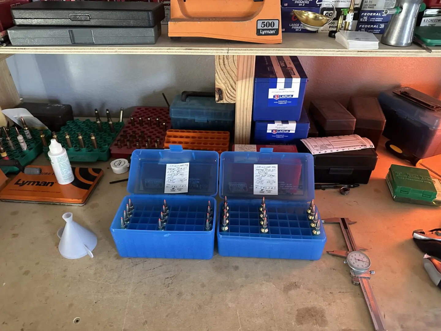Workbench with organized tools and boxes.